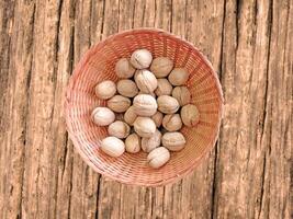 Nuts On The Wooden Background photo