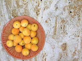 Apricots On Marble Background photo