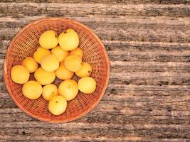 Apricots On The Wooden Background photo