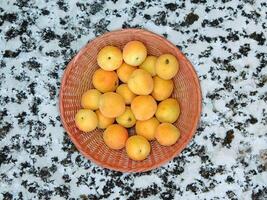 Apricots On Marble Background photo