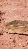 old book in red rock desert video