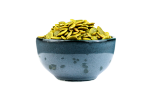 Pumpkin seeds in ceramic bowl isolated on a transparent background png