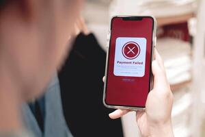 Payment failed, declined. Red online financial transaction notification in application showing error on smartphone. Concept of online banking, encrypting transactions and secure connection. photo