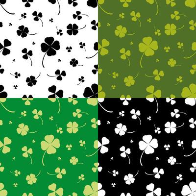 set of seamless patterns with silhouettes of clover leaves. Ornament for decoration and printing on fabric. Design element. Vector