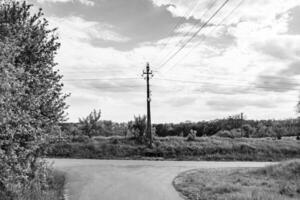 Power electric pole with line wire on dark background close up photo