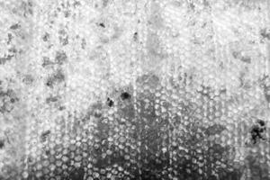 Drop of bee honey drip from hexagonal honeycombs filled with golden nectar photo
