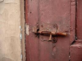 old brown door latch in the open state photo