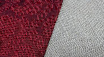 Texture, background, pattern. The fabric is red with a pattern of geometric figures. This is a detailed close-up of the fabric. photo