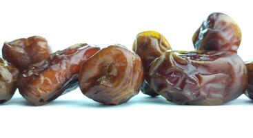 Dates fruit isolated on white background. Close up. Selective focus. photo