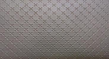 Texture of metal sheet with rhombus pattern. Abstract background. photo