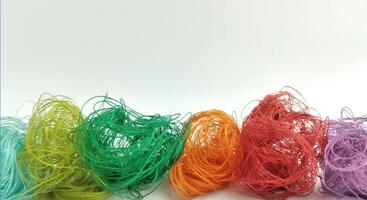 Colorful threads on a white background close-up. Selective focus. photo