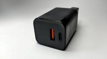 Black power plug on a white background. Close-up, isolate photo