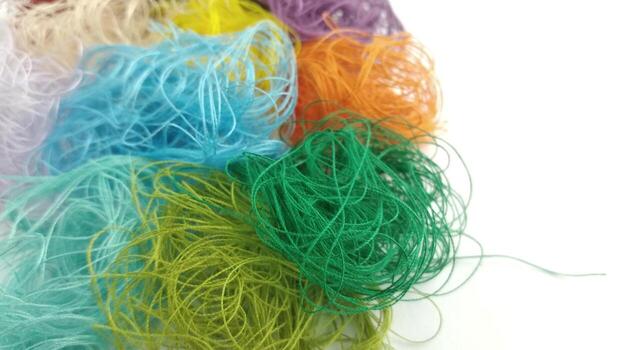 Colorful threads on a white background close-up. Selective focus. photo