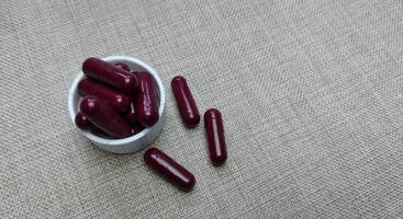 capsule pill medicine on a cloth background photo