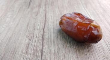 Dates fruit on wooden table. Top view with copy space. photo