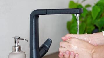 Close up of woman washes hands and uses soap from the reusable bottle. Eco-friendly lifestyle. High quality 4k footage video