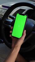 People using vertical phone green screen in car video