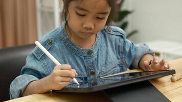 Young Girl Drawing on Digital Tablet with Stylus Pen. video