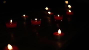 Many burning candles with shallow depth of field. video