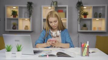 Female student using phone while dancing. video