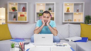 Home office worker man looking annoyed at camera. video