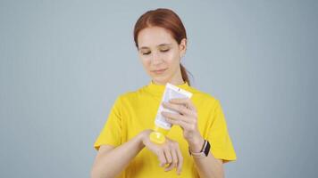 Woman applying cream to hand. Skin beauty. video