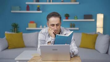 Man with notebook thinks and takes notes. video