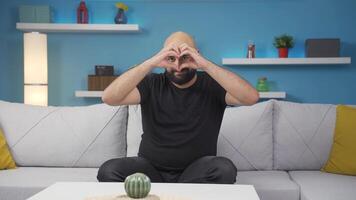 Man making heart symbol for camera. video