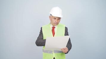 The engineer examines the project in his hands. video