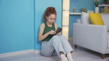 The woman sitting by the wall looks at her empty wallet. Broke. video