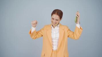 Business woman dancing with phone in hand. video