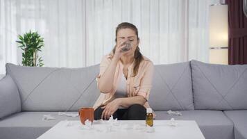 The sick woman drinks a lot of water. video