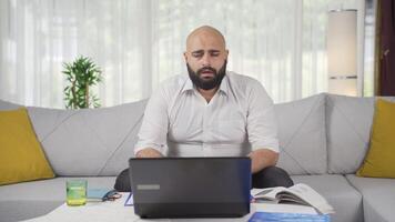 Home office worker man looking dull at camera. video