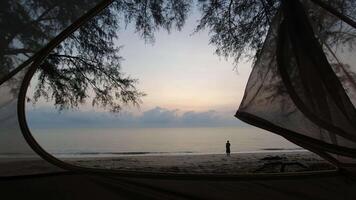 time lapse of sunrise with woman walk on sandy beach concept video