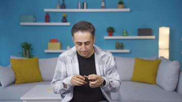 Penniless man looking at his empty wallet. video