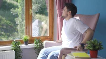 A lively and energetic man. Laughing out the window with happy expression. video