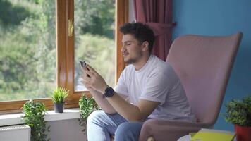 Man texting with happy expression. video
