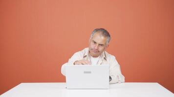 Man closing laptop with angry expression. video