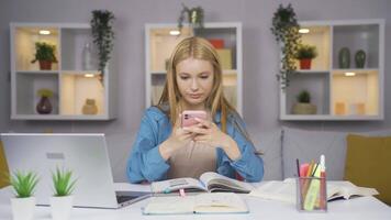 Female student chatting on the phone. video