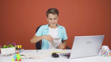 Boy distributing banknotes and tossing them into the air. video