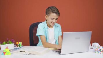 Boy chatting on laptop. video