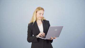 Business woman looking at laptop with tired expression. video