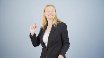 Business woman dancing to the camera. video