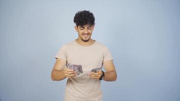 Man distributing banknotes and tossing them into the air. video