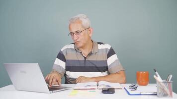 Man looking at laptop is thoughtful. video