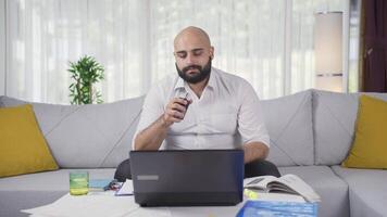 Home office worker sprays perfume on man. video