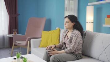 The grieving young woman is thinking and suffering from depression. video