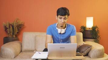 Man looking at laptop is unmotivated and bored. video