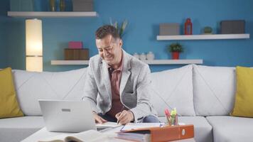 Home office worker man looking with satisfied expression. video