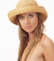 Topless young blond woman in straw hat photo